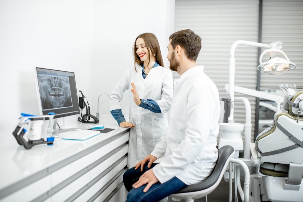 Dentist in white coat