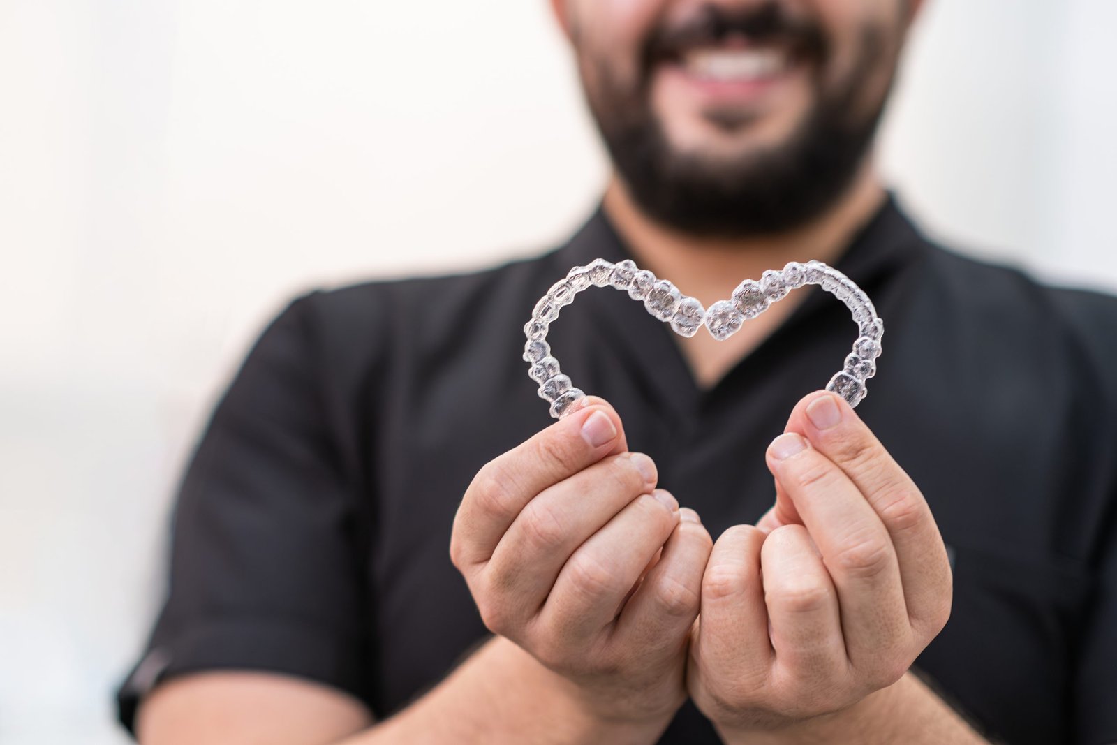 Orthodontist fitting aligners